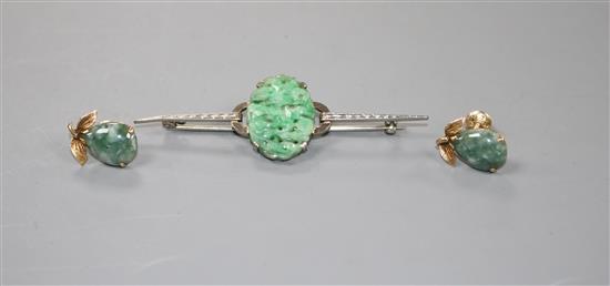 A 9ct white metal and carved oval jade plaque set bar brooch and a pair of 14k and simulated jade earrings,